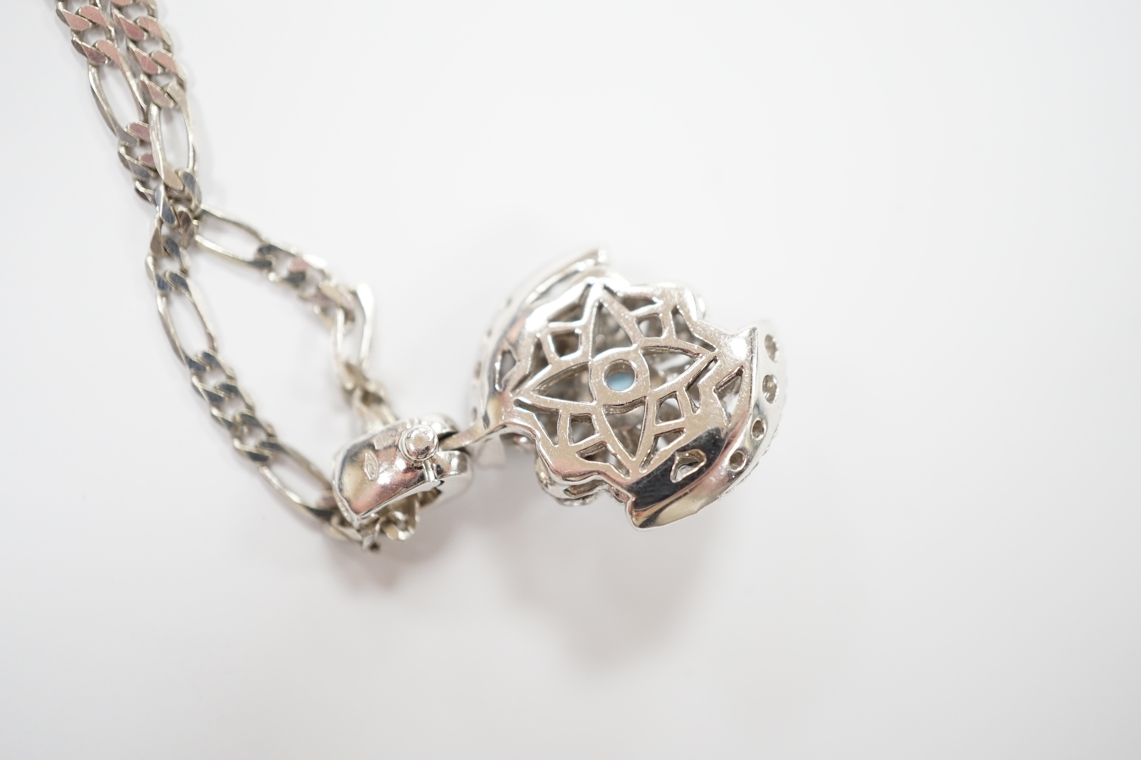 A modern 14ct gold, topaz? and simulated diamond chip cluster set pendant, 20mm, on a 9ct chain, 44cm, gross weight 11.2 grams